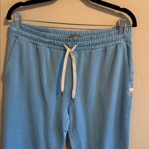 Vuori performance joggers in light blue. NWOT sold out online